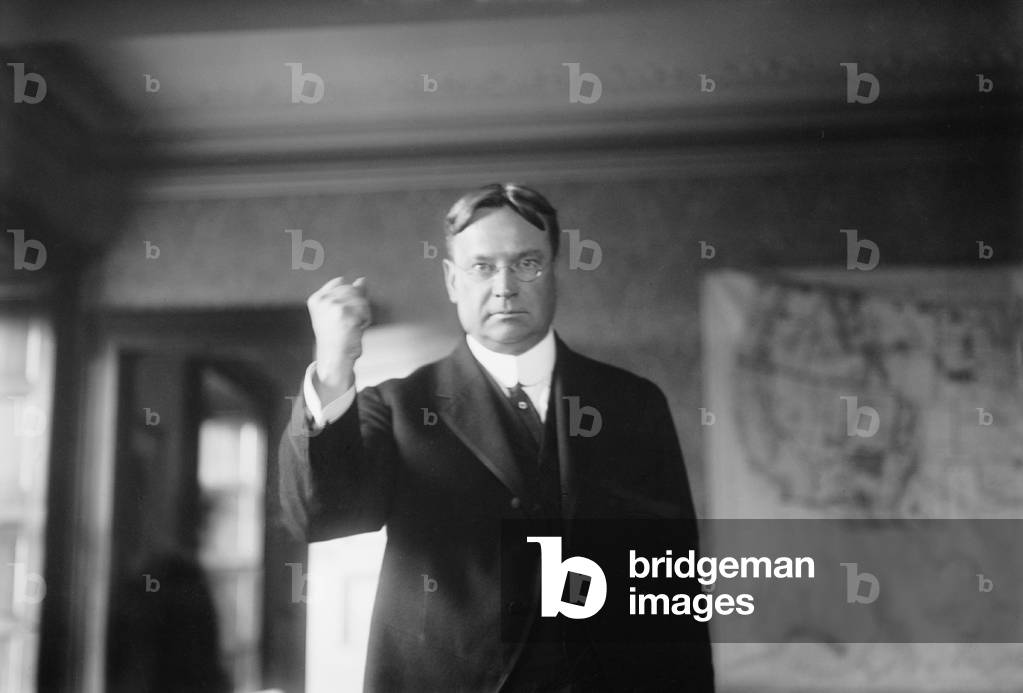Hiram W. Johnson, (1866-1945), California Senator, from 1917-1945, with a clenched fist. He was a progressive Republican, often voting with Democrats during the early New Deal years. c. 1920