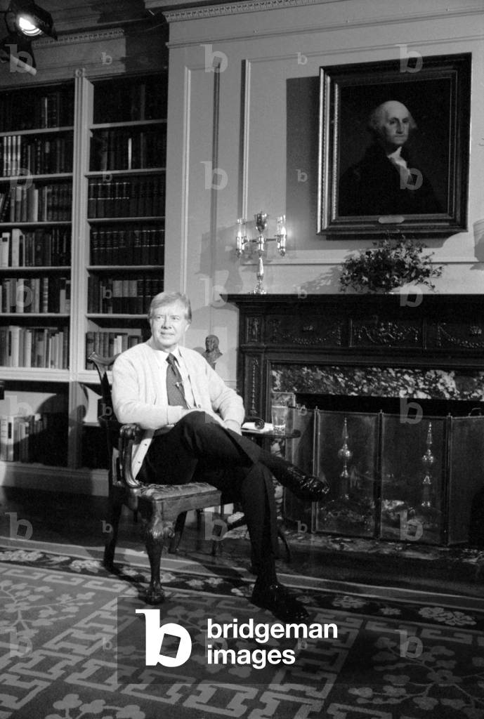 Jimmy Carter sports a cardigan in the White House library during a televised fireside chat (Address to the Nation on Energy). April 18, 1977