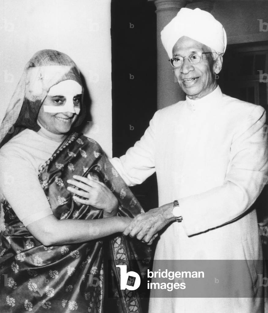 Prime Minister Indira Gandhi, her nose heavily bandaged, recuperating at her home. India's President, Dr. Sarvepalli Radhakrishnan, visited her on Feb. 13, 1967. Mrs. Gandhi was struck by a stone thrown by a heckler during a campaign rally