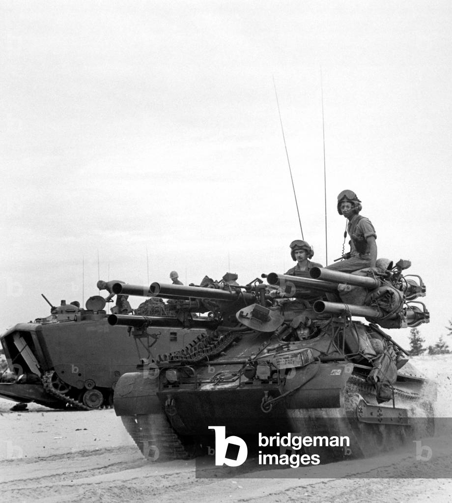 Vietnam War. US troops arriving on South Vietnam's Chu Lai beach during the 1965 escalation. The foreground vehicle is an 'Ontos', Greek for 'Thing,' an armored tracked anti-tank vehicle highly effective in Vietnam fighting. June 1965