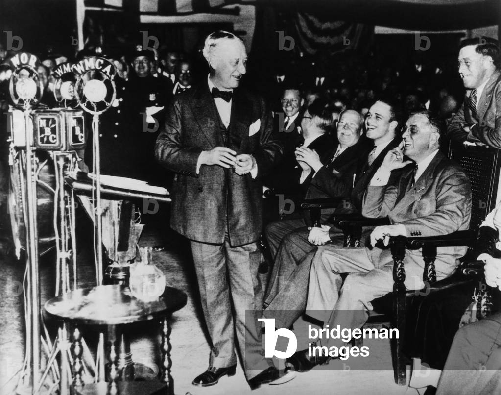 Future President Franklin D. Roosevelt (sitting, right), and former New York Governor Al Smith (left), at a Democratic rally in the Academy of Music, Brooklyn, New York, November 4, 1932