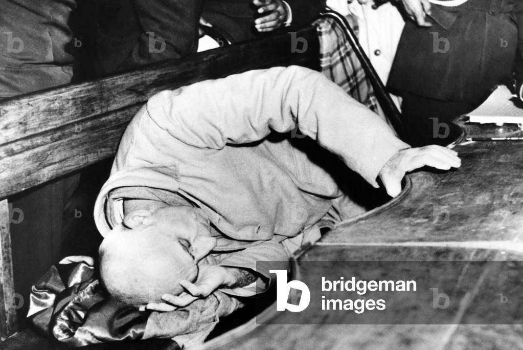 Ousted Iranian Premier Mohammed Mossadegh on trial for treason. Nov. 14, 1953. After the British-US backed coup reinstalled the Shah to absolute power, the democratically elected, now deposed Premier, stretches out on his courtroom bench despair