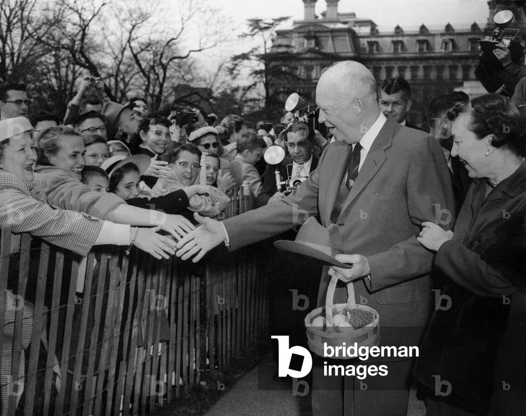 President Dwight and Mamie Eisenhower greeting citizens on during the annual Easter Egg Roll. c. 1953-1960