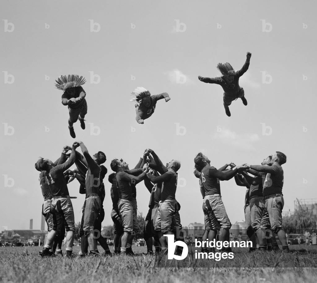 Washington Redskins training by 'flying thru the air', Aug, 28, 1937 (b/w photo)