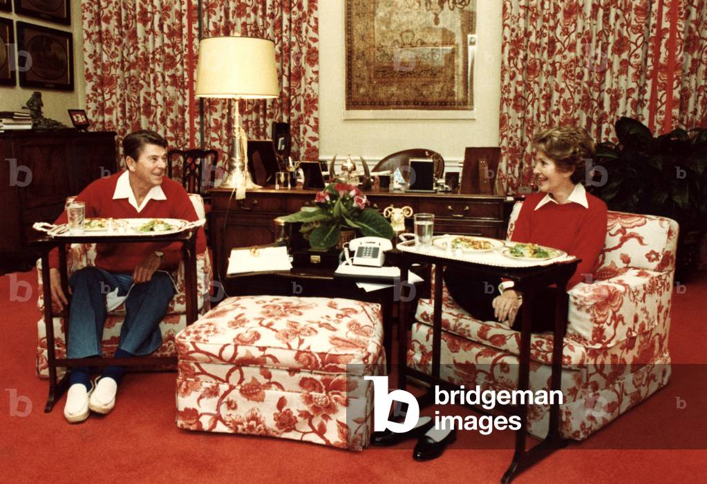 President Ronald Reagan, Nancy Reagan dining from trays in the White House, 1981