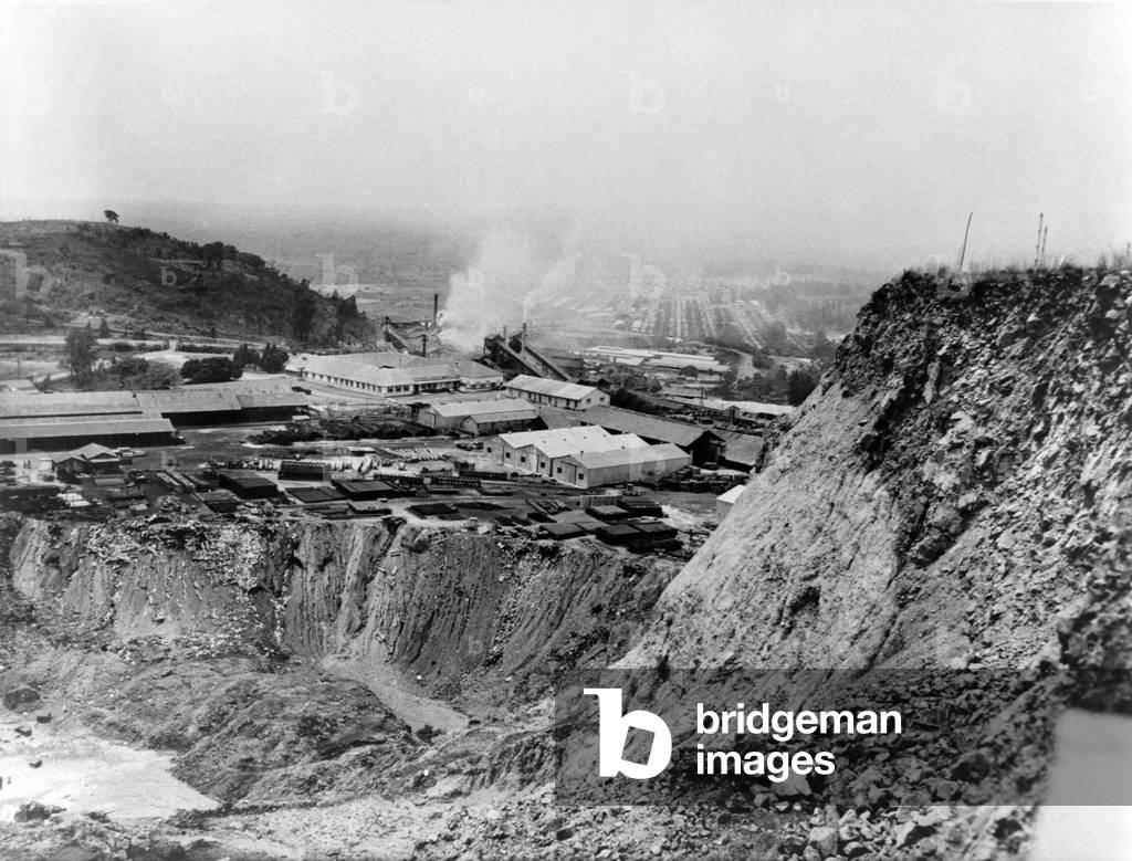 Copper smelting plant and area below that has been strip mined, Katanga province, Congo in August 1960 during the provinces session and other political troubles that accompanied the independence of the former Belgian Congo in 1960