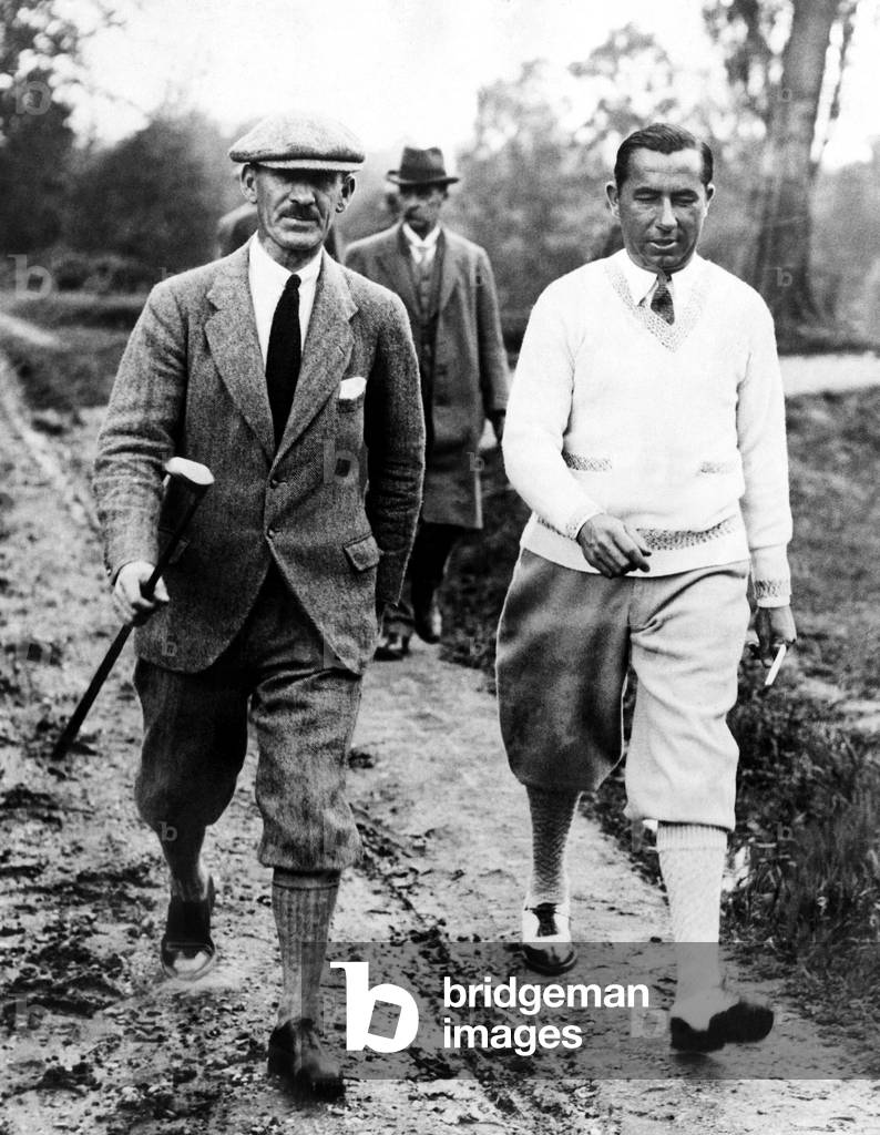 Golfers Abe Mitchell Walter Hagen at the golf course at Weybridge, England during a match. June 25, 1926.