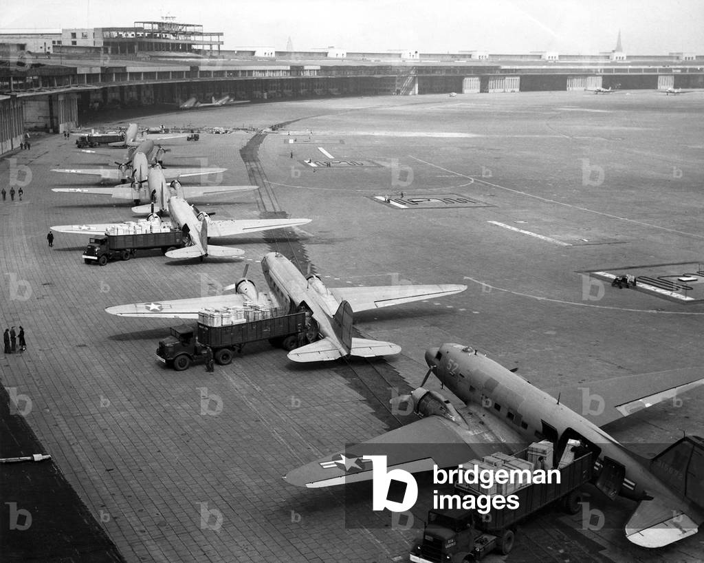 C-47s unloading at Tempelhof Airport during the Berlin Airlift, June-August, 1948 (b/w photo)