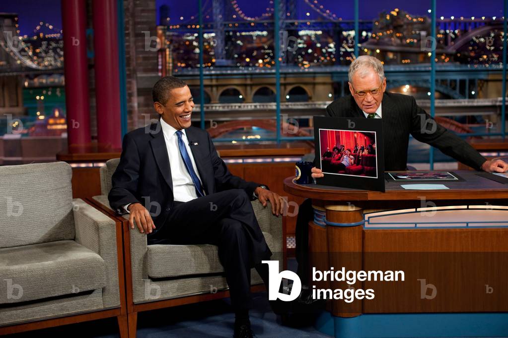President Obama reacts to a photograph of himself displayed by David Letterman during his appearance on Sept. 21 2009.,