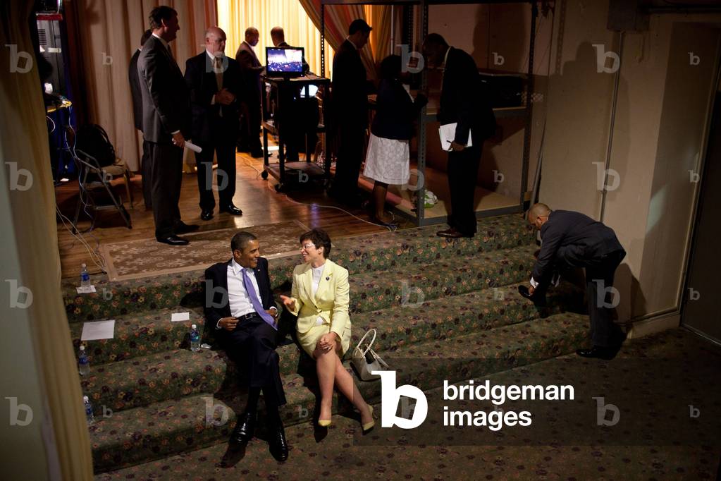 President Barack Obama relaxes with Senior Advisor Valerie Jarrett. They talked backstage before a reception in Philadelphia, Pa., June 30, 2011