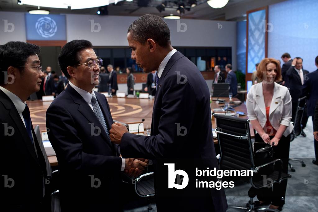 President Barack Obama talks with President Hu Jintao of China after the APEC summit. At right is Prime Minister Julia Gillard of Australia. Honolulu, Hawaii, Sunday, Nov. 13, 2011