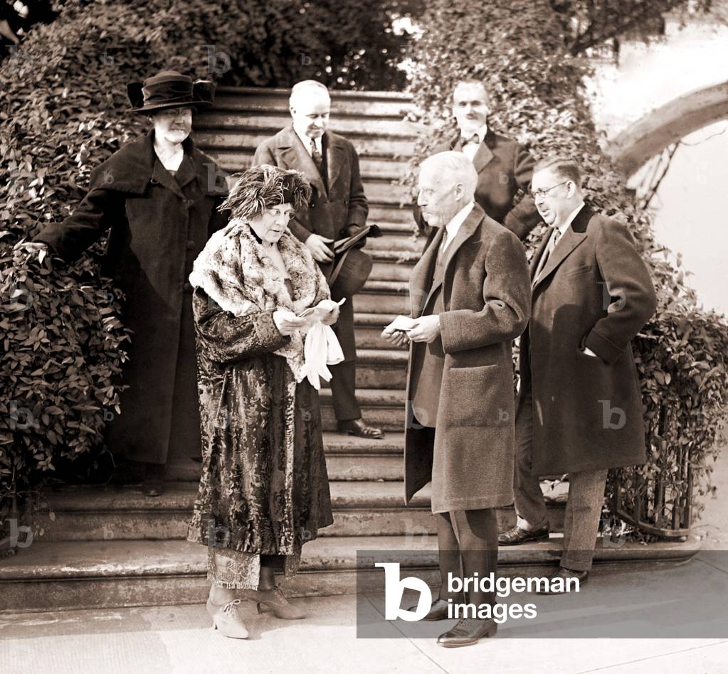 First Lady Florence Harding and Treasury Secretary Andrew Mellon outside the White House. With them are the corrupt Ohio Gang leader, Harry Daugherty (center back), his wife, and his roommate, bag man, and 1924 suspicious death victim, Jess Smith (far right). Dec. 20, 1921