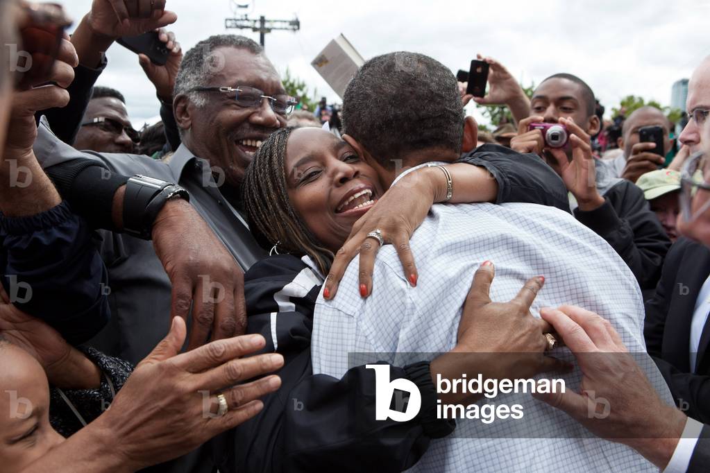 Barack Obama: President Barack Obama hugs a woman in the crowd after addressing the Labor Day celebration in Detroit, Mich., Sept. 5, 2011 (photo)