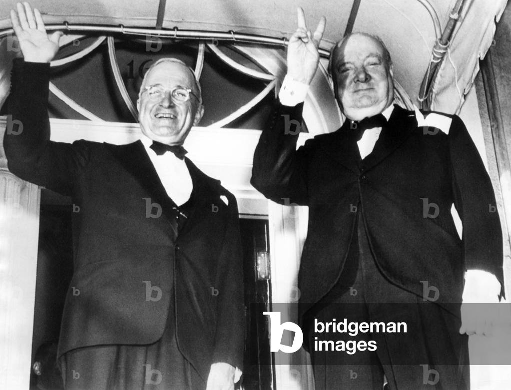President Harry Truman, former British Prime Minister Winston Churchill, on the front porch of Blair House, Washington D.C., 1949.