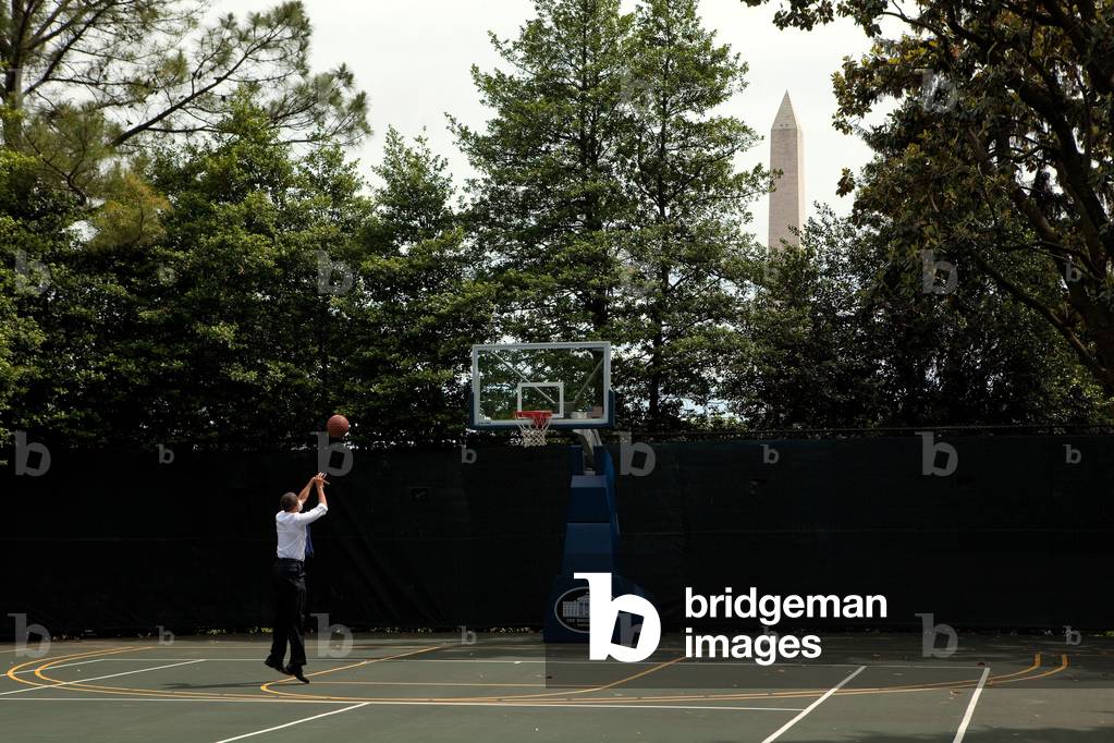 President Barack Obama shoots hoops on the White House basketball court during a break between meetings May 7 2010.,