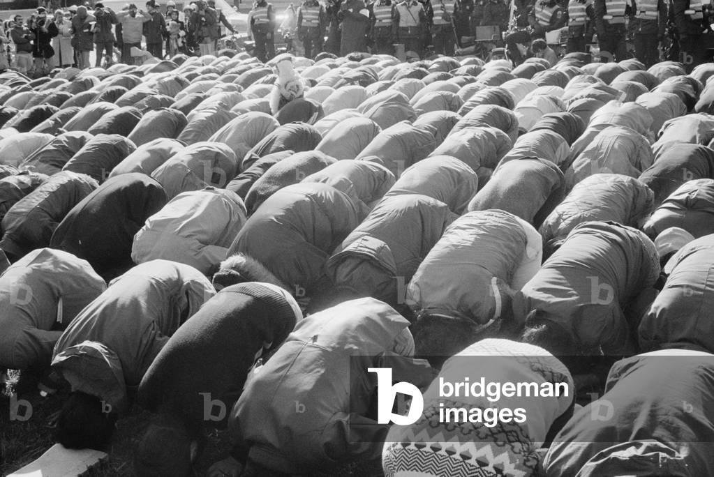 Iranian men kneeling in prayer at an demonstration during the Iran Hostage Crisis in Washington D.C. Nov. 30 1979