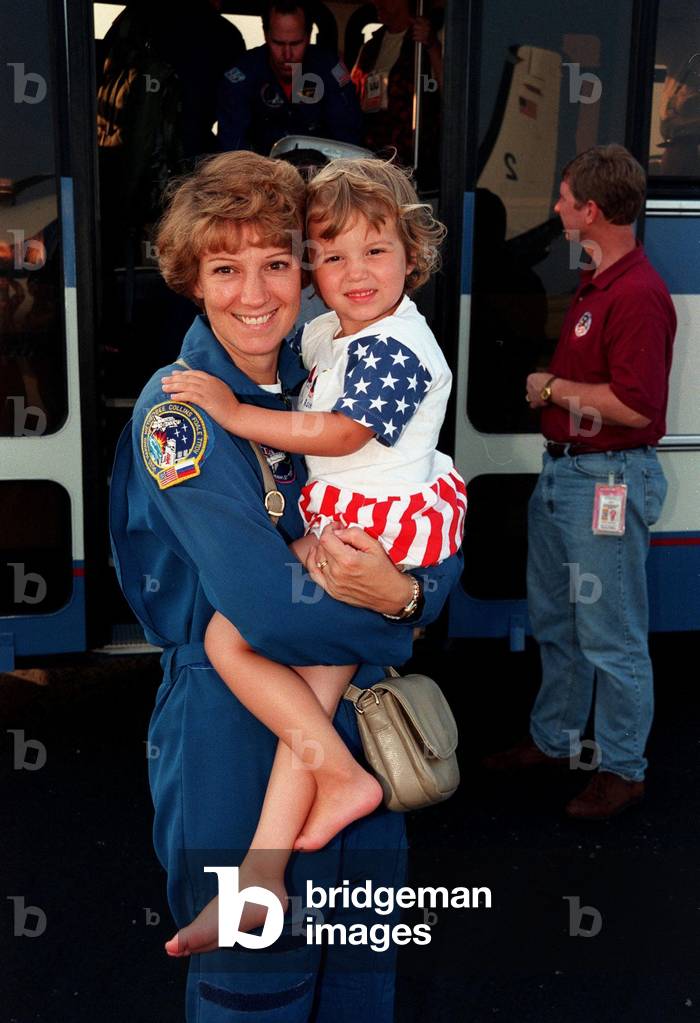 Commander Eileen Collins and her daughter, Bridget Youngs, following the completion of the Space Shuttle mission 95. July 28, 1999