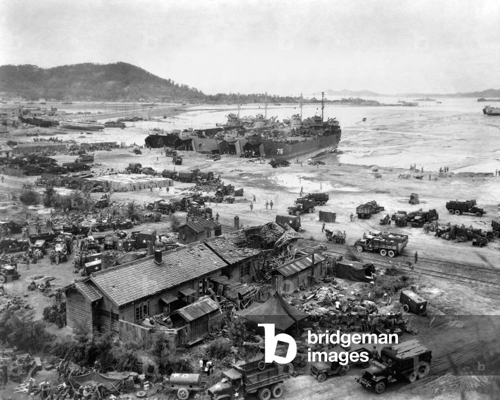 Four LST's unload men and equipment on 'Red Beach' at Inchon, Korea. Sept. 15, 1950. In the week following the invasion, more than 25,000 tons of supplies, 6600 vehicles and 50,000 personnel came ashore at Inchon. Korean War, 1950-53
