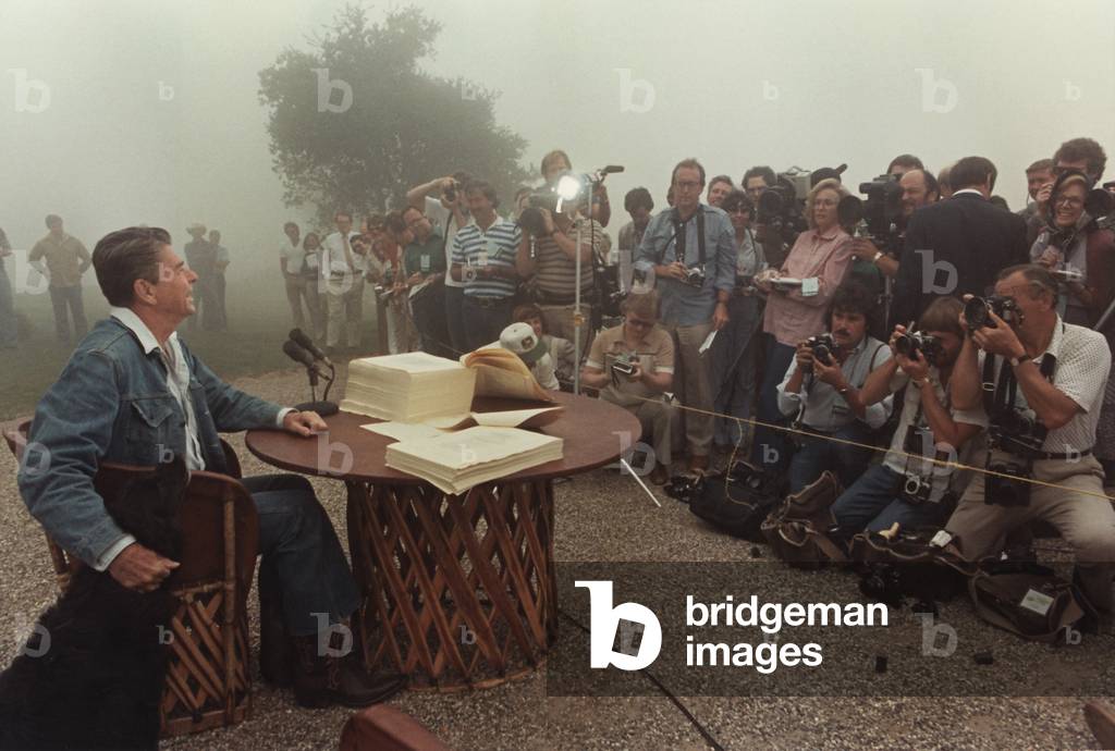 President Reagan meeting with the Press after signing the landmark Tax Reconciliation Bill at his California home Rancho Del Cielo. It provided for three years' reductions totaling 25 percent in individual tax rates. PO-USP-JOUR-Reagan_NA-12-0076M