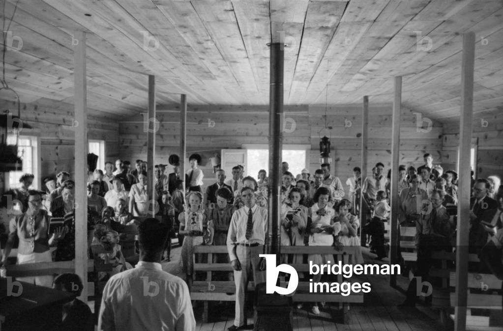 Religious service in the Pie Town, New Mexico church. Pie town was settled in the 1930's by 250 homesteader families who migrated from the Dust Bowl. June 1940