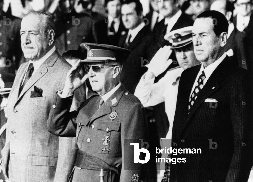 Juan Peron, Spain's Francisco Franco, and Argentine President Dr. Hector J. Campora. After 18 years of political exile, former President Peron returned to Argentina escorted by Dr. Campora. June 20, 1973.