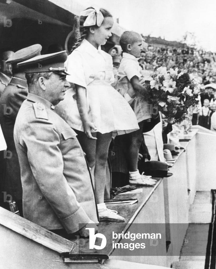Josef Stalin in the reviewing stand for the All Moscow Physical Culture Parade. Moscow's Dynamo Stadium, July 20, 1947. The children presented him flowers on behalf of Moscow schoolchildren