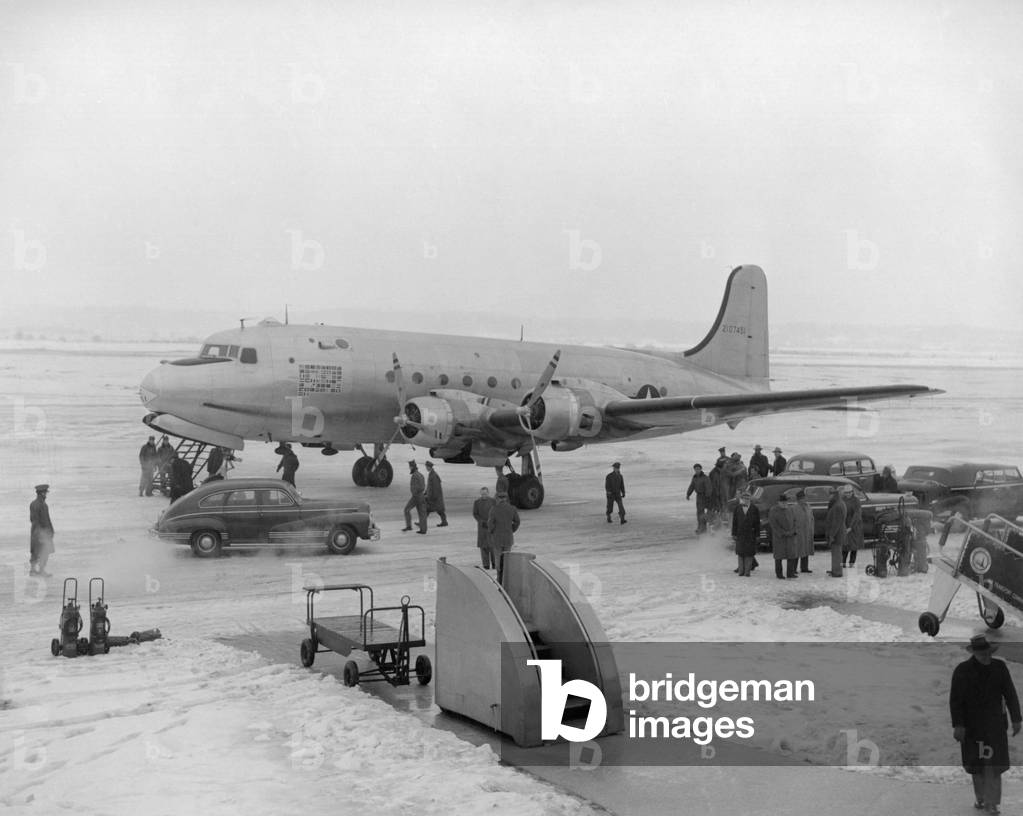 President Harry Truman's airplane before taking off for Independence, Missouri. Dec. 25, 1945. The Douglas C-54 Skymaster was previously known as FDR's 'Sacred Cow'. Washington's National Airport.
