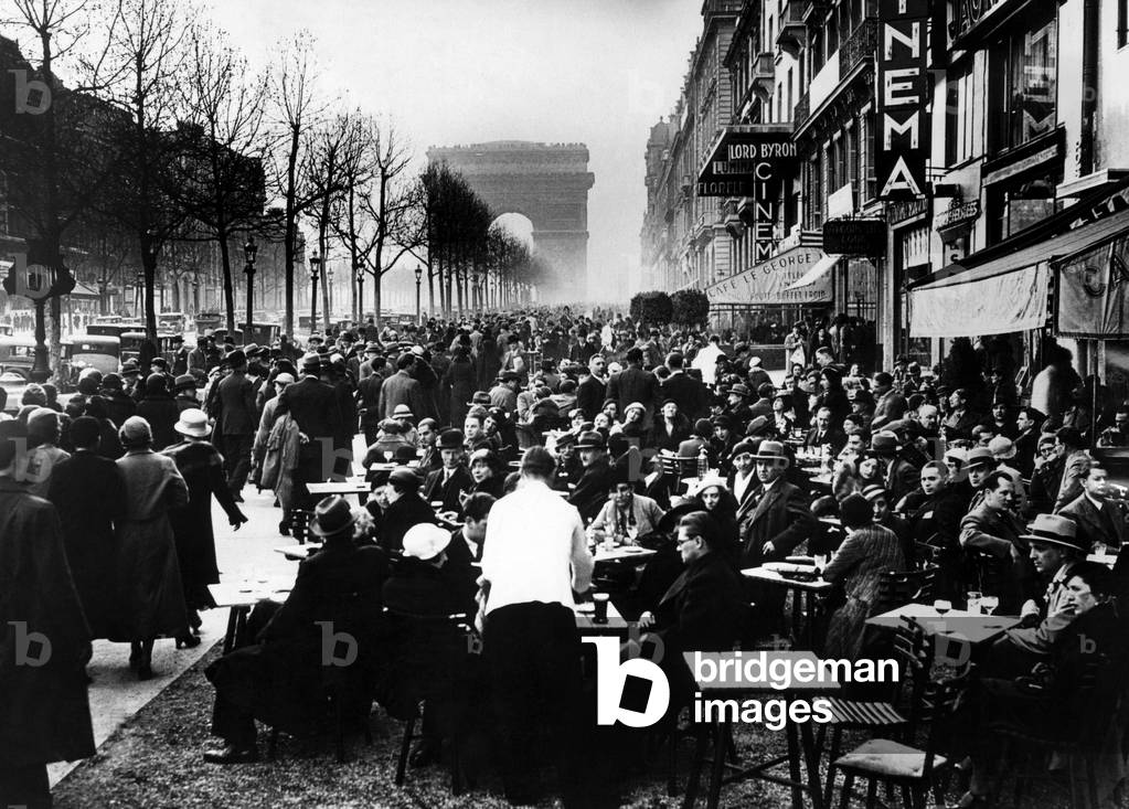 Easter Monday on the Champs Elysees with customers at Apertif hour. 4/10/34.