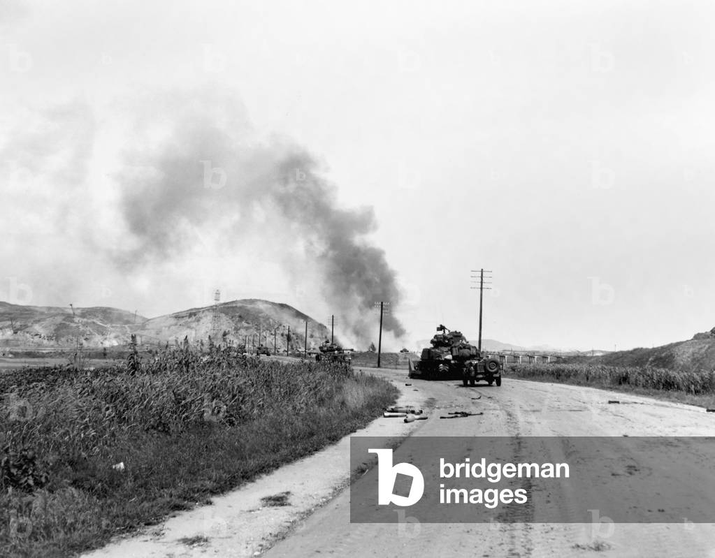 U.S. Marine tanks blast their way through North Korean strong points near Seoul allowing infantrymen to advance. 1st Marine Division of the Inchon-Seoul Highway. c. Sept 18-21, 1950. Korean War, 1950-53