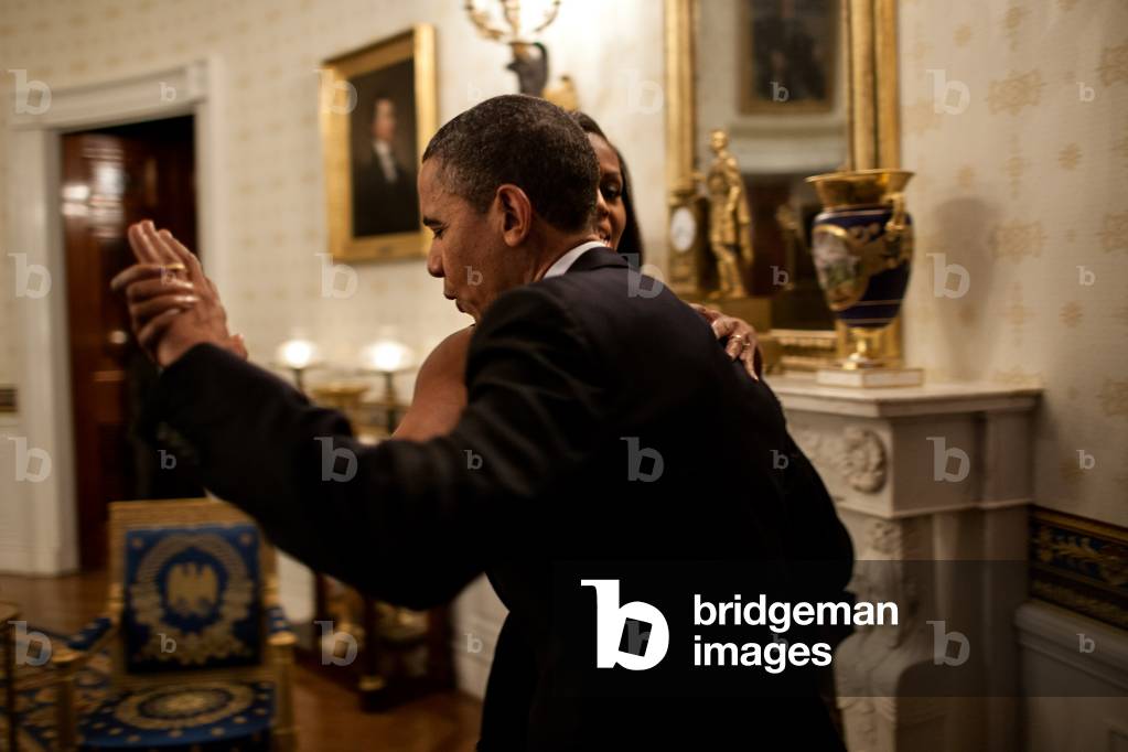 President Barack Obama dances with First Lady Michelle Obama in the Blue Room of the White House prior to an 