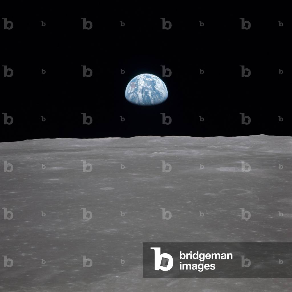 Apollo 11 Earth rise over the Moon. Earth on the horizon in the Mare Smythii Region of the Moon. Image 7 of a NASA sequence of 18. July 20, 1969