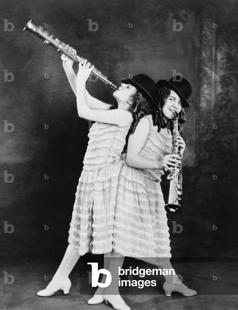 Daisy and Violet Hilton (1908-1969), British born conjoined twins abandoned by their mother and trained as entertainers by their exploitive caretakers. They were trained to play clarinets for a jazz act in the 1920s. After breaking away from their caretakers, they toured in the U.S. sideshow and vaudeville circuit in the 1930s