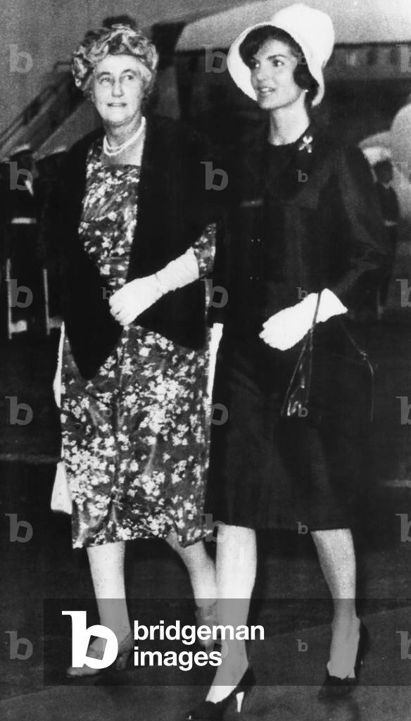 Lady Dorothy MacMillan, wife of British Prime Minister Harold MacMillan, and Jacqueline Kennedy, walking from the Presidential Plane after arrival to London. June 4, 1961