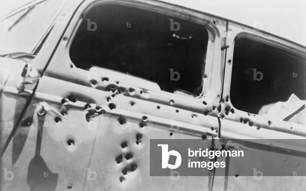 The bullet riddled car in which bank robbers Bonnie and Clyde died at the hands of Texas Rangers and Louisana police at Gibsland, Louisiana on May 23, 1934. Faye Dunaway and Warren Beatty stared in the 1967 film, BONNIE AND CLYDE