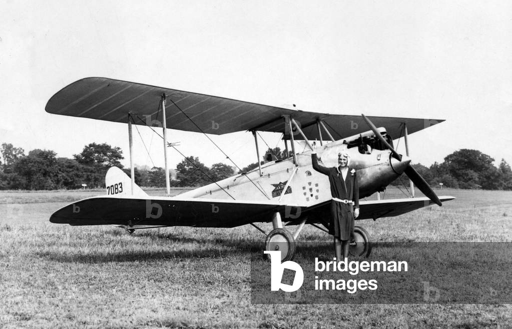 Amelia Earhart shown with her plane, 1928 (photo)