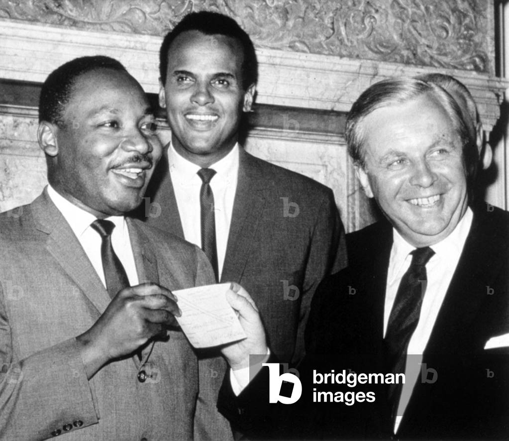 Martin Luther King, Jr., accepting a ,000 check from Tore Tellroth, the Swedish Consul General. Harry Belafonte is center. The money was raised in Sweden for Dr. King's civil rights work, 1966