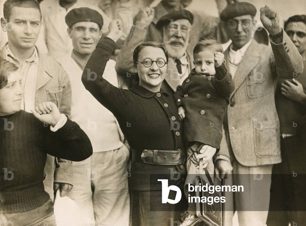Defeated Spanish Republican refugees give their clenched fist salute in Bordeaux, France. Spanish Civil War. 1939