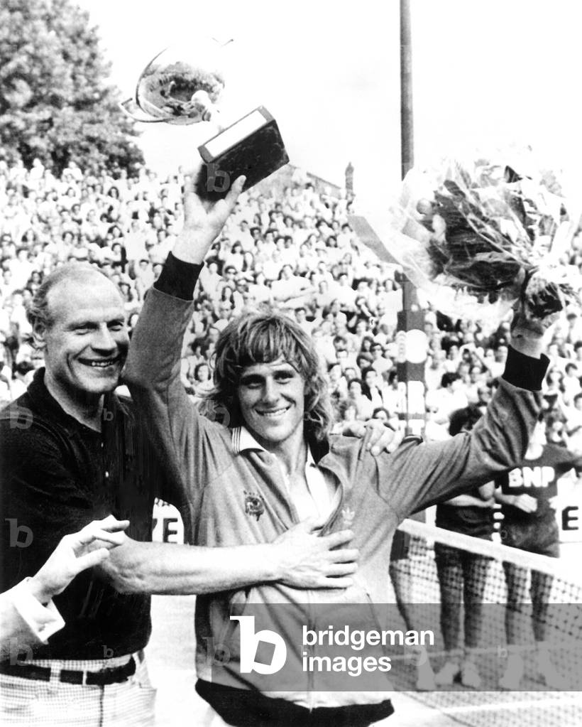 Bjorn Borg, holding up his winner's cup, 6/19/1974.
