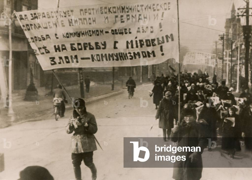 White Russians demonstrate in support of the German-Japanese co-operation pact against Communists. Hsinking, Manchukuo. Dec. 18, 1937.