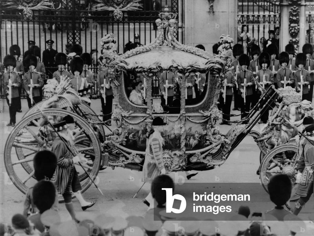 Queen Elizabeth II riding in the Gold State Coach enroute to her coronation. June 6, 1953.