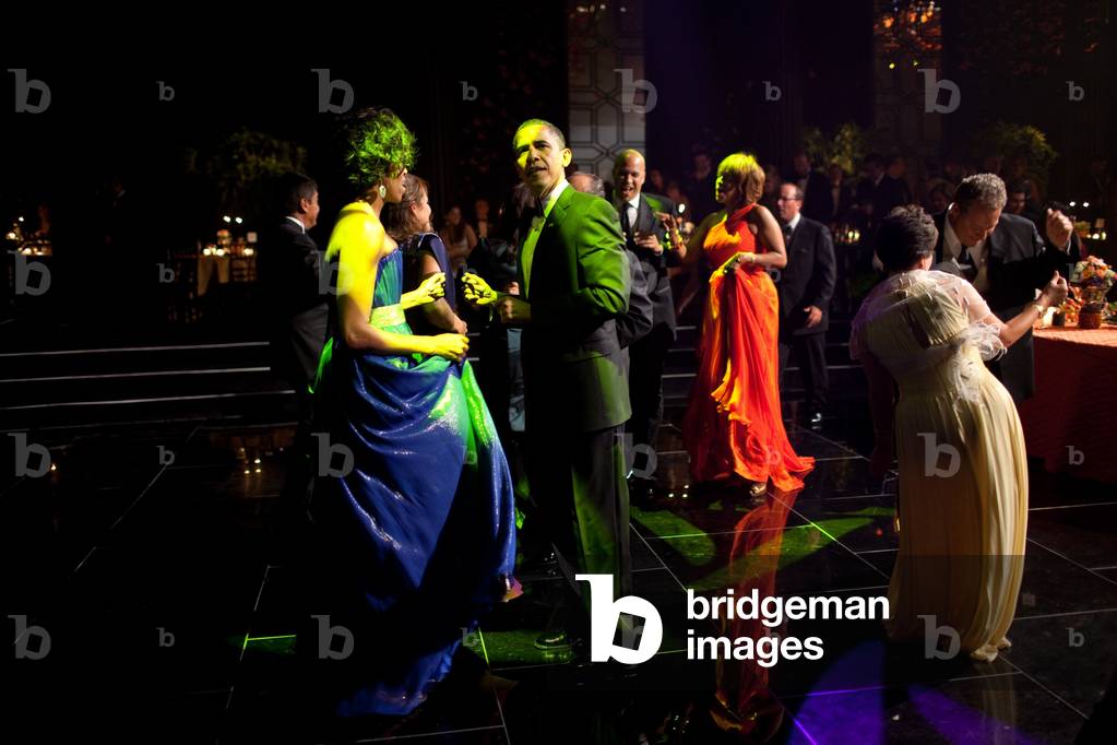 President and Michelle Obama dance to music performed by the United States Marine Band during reception before the State Dinner for Mexican President Calder n. Gayle King and Cory Booker dance in the background. Michelle wears a one shoulder chiffon and silk gown by Peter Soronen. May 19 2010,