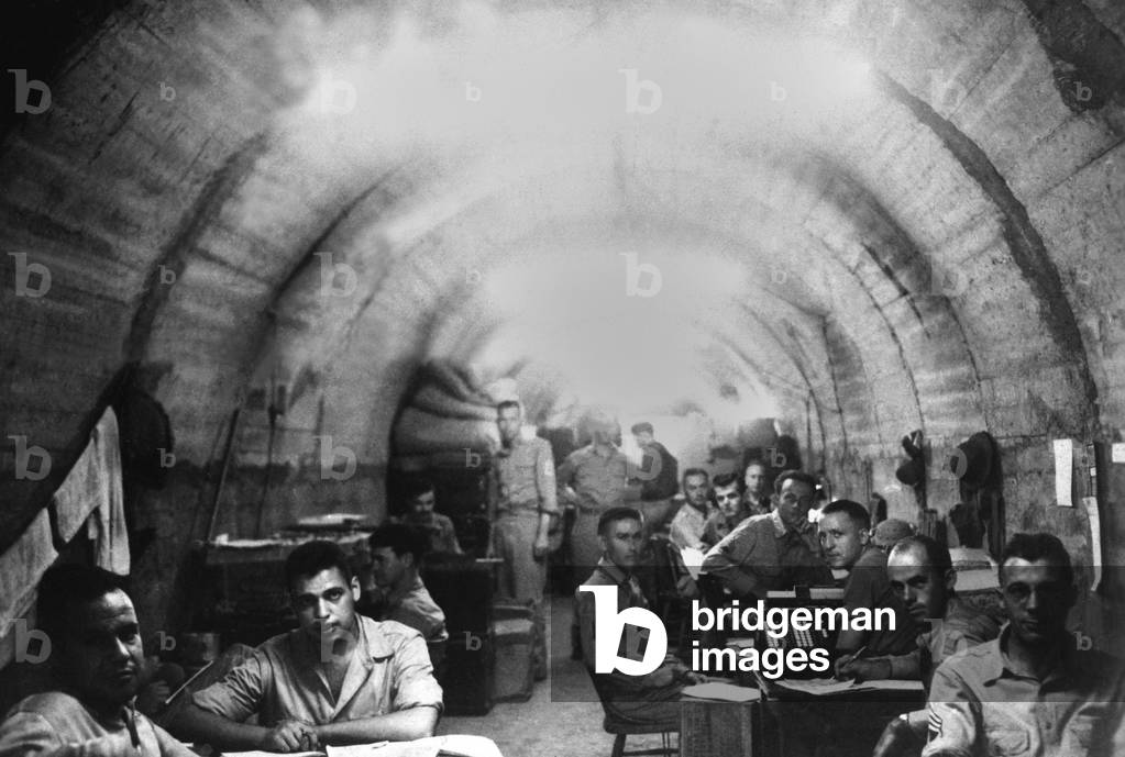 American Army headquarters in a fortified tunnel on Corregidor, Philippine Islands, c. March/April 1942. The tunnel was the last U.S. Headquarters after final Japanese conquest on May 6, 1942. The soldiers were with the Signal Corps, and would become POWS until the end of World War 2 in 1945, if they were lucky enough to survive Japanese camps