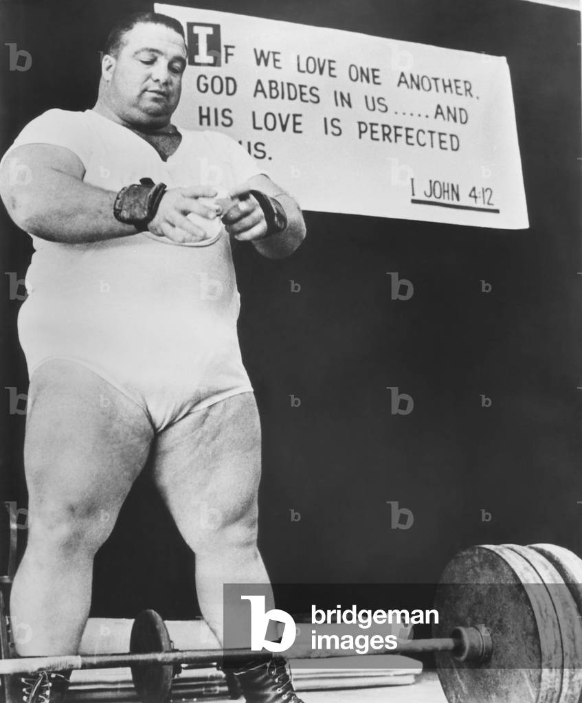 Paul Anderson, performed at weight lifting and strength exhibitions. He gave up his amateur status by accepting money for these performances. c. 1969