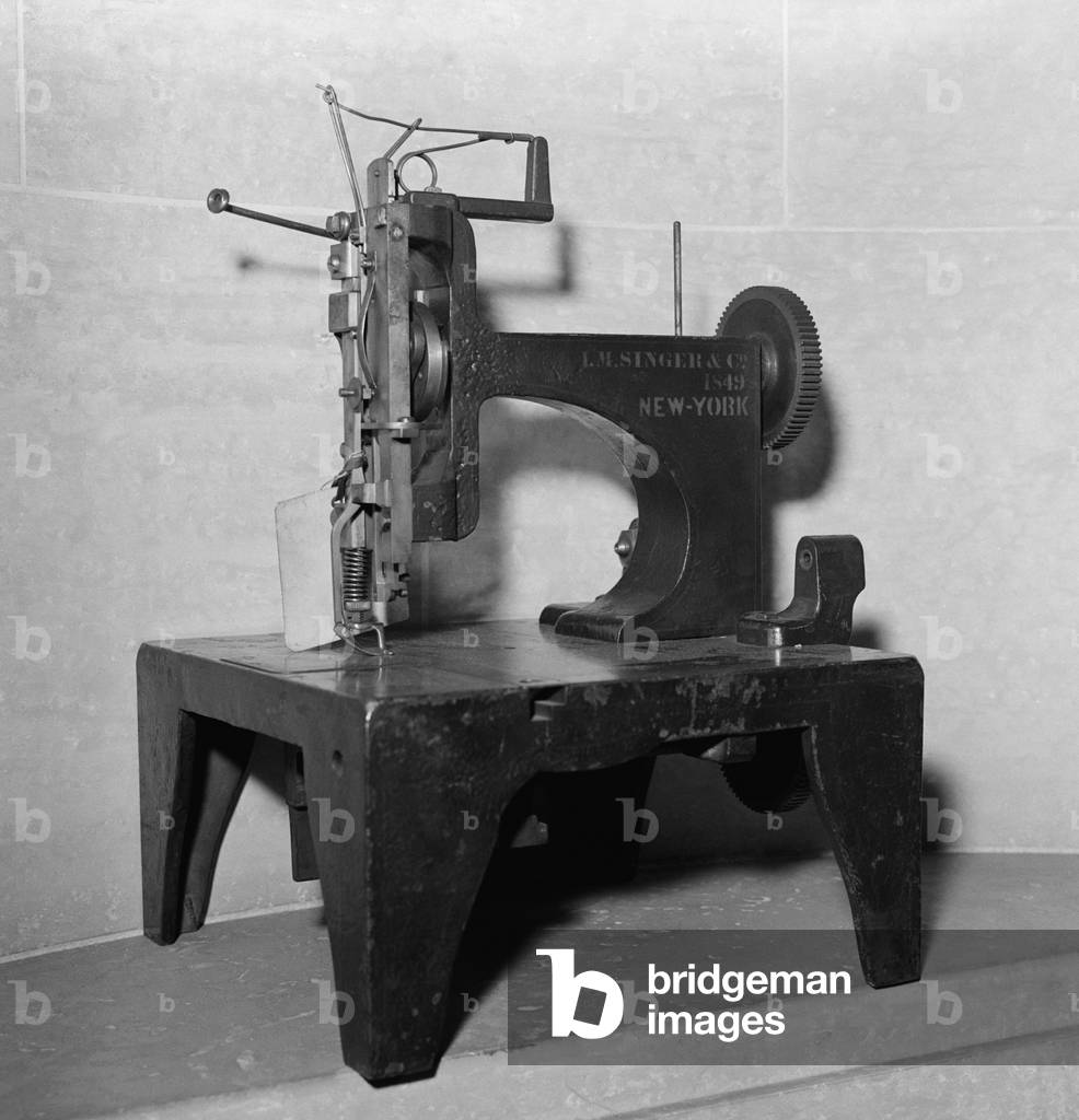 1849 model of the first commercially successful sewing machine. Invented by Issac Singer, it used the lockstitch patented by Elias Howe. Singer built the first sewing machine with verticle needle movement powered by foot treadle rather than a hand crank