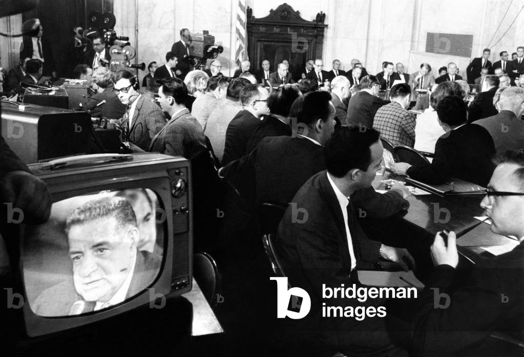 Senate Caucus Room during Joseph Valachi's testimony. Valachi is seen on the TV monitor and members of the Committee are shown in the background. Valachi agreed to testify on the workings of the underworld crime empire, 'Cosa Nostra'. Sept.27. 1963