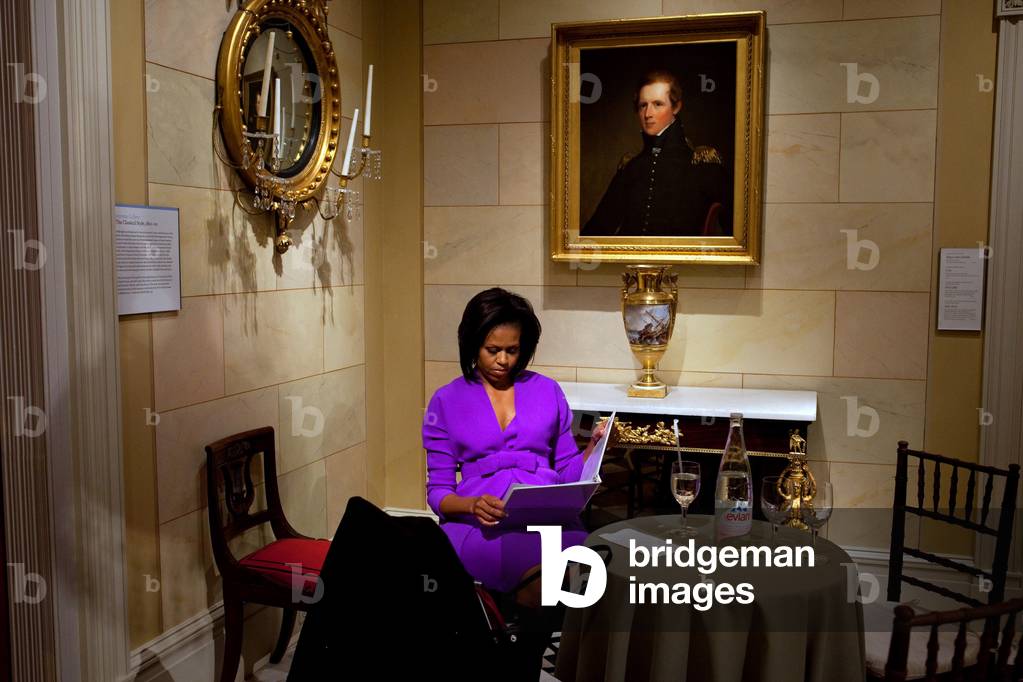 Michelle Obama prepares before speaking at the Metropolitan Museum of Art in New York City. Michelle wears a dress and coat of purple wool-silk blend from Isacc Mirahi's Pre-Fall 2009 collection. May 18 2009.,