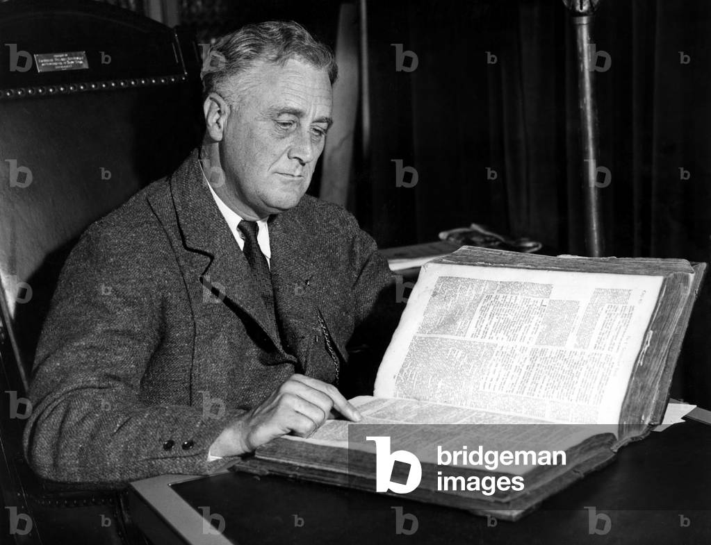 President Franklin Delano Roosevelt (1882-1945) 32nd President, with 263 year old family bible to be used for his oath of office, 2/27/33