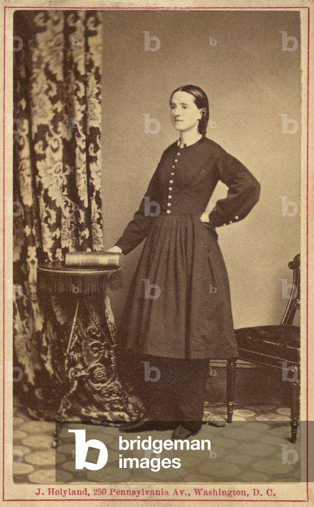 Dr. Mary Edwards Walker (1832-1919), Civil War surgeon. She is the only known female physician to serve in battle during the U.S. Civil war. She is wearing her reformist dress, consisting of full length slacks under an abbreviated full skirt and uncorseted jacket. Photograph by John Holyland, c. 1865