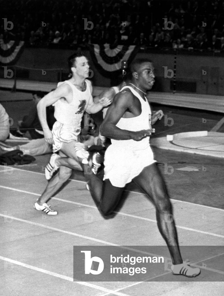 Bob Hayes, winning the 60-yard dash at the 96th Annual N.Y. Athletic Club Track Meet, New York, NY, 02/13/64