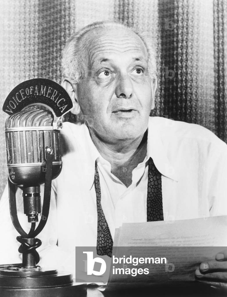 Gabriel Heatter, radio reporter and commentator, broadcasting over 'Voice of American' in 1950. In the Cold War years, VOA broadcasts countered the propaganda of the Soviet Union and Warsaw Pact governments